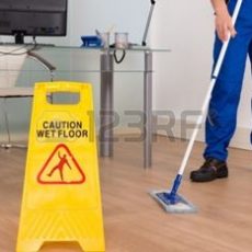 35462891-close-up-of-janitor-mopping-with-wet-floor-sign-in-office-4.jpg